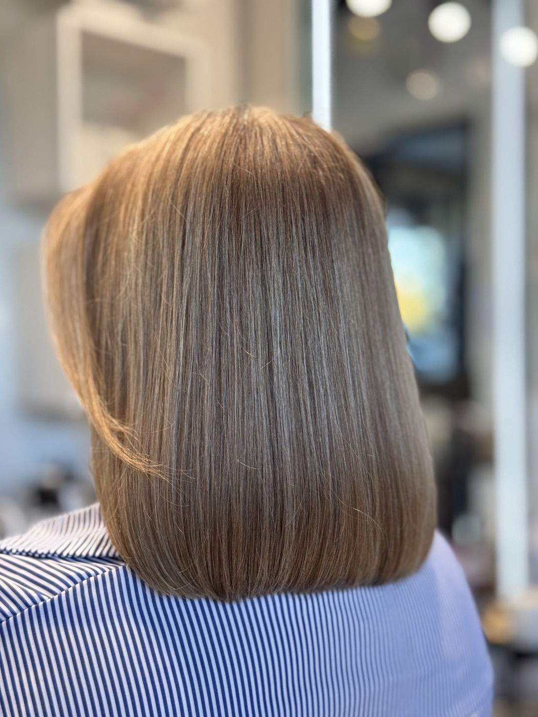 Chin-length blonde bob blowout
