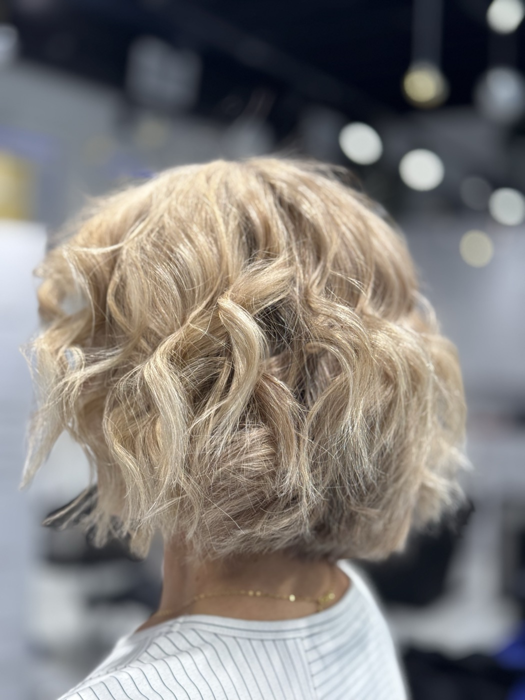 Short textured curly blonde bob
