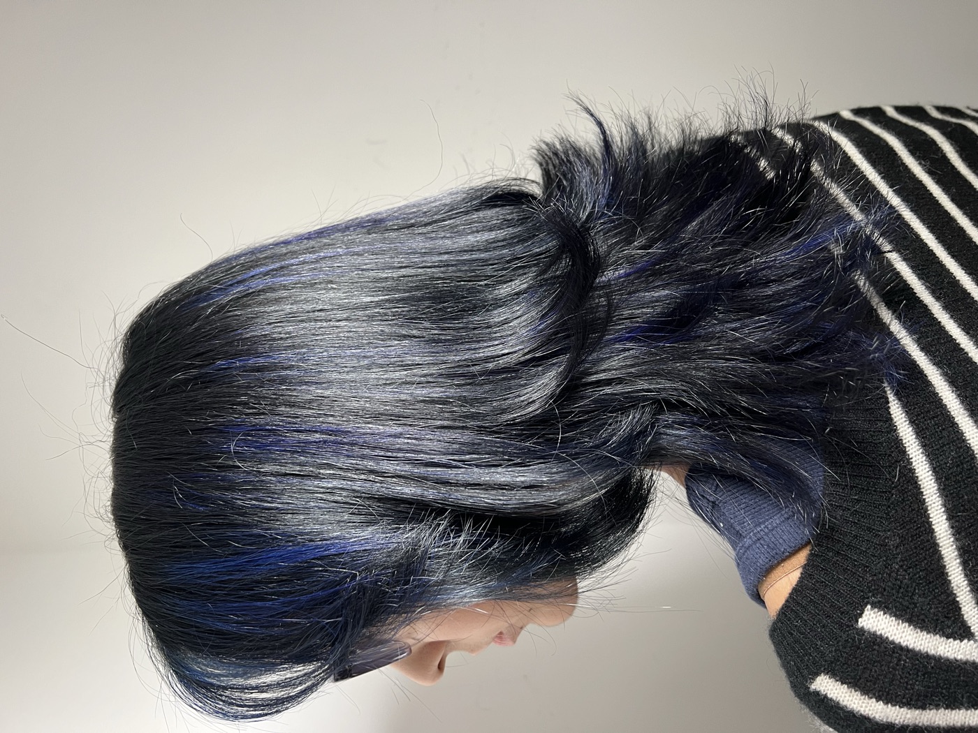 Long dark hair with blue-toned money-piece coloring