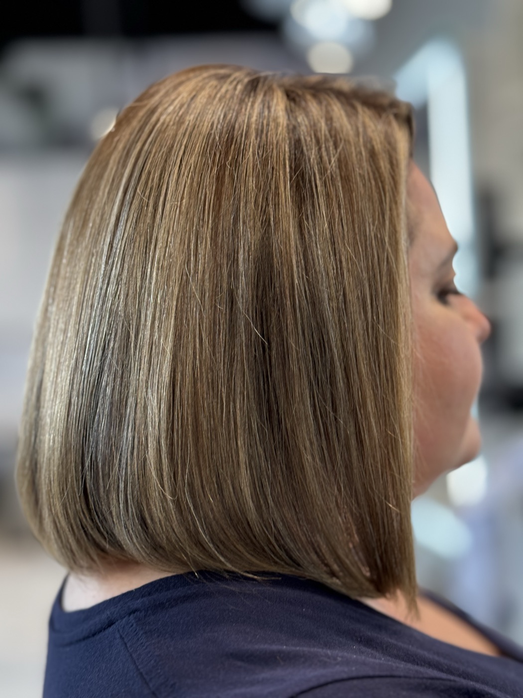 Shoulder-length blonde bob with highlights