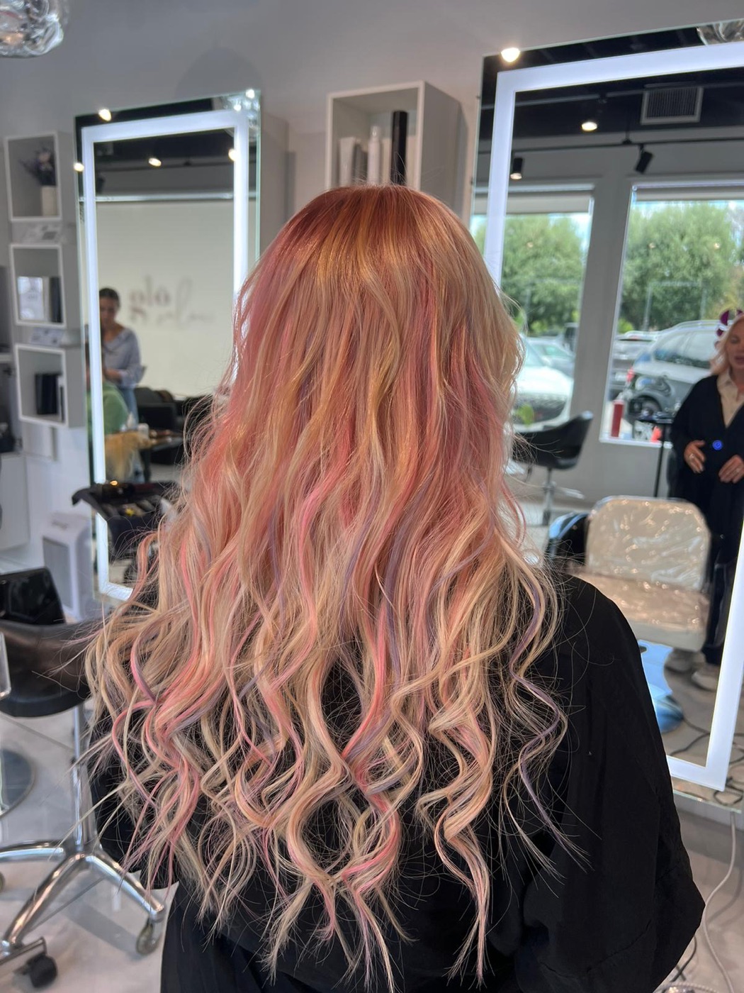 Long wavy hair with rose-gold and pink tones