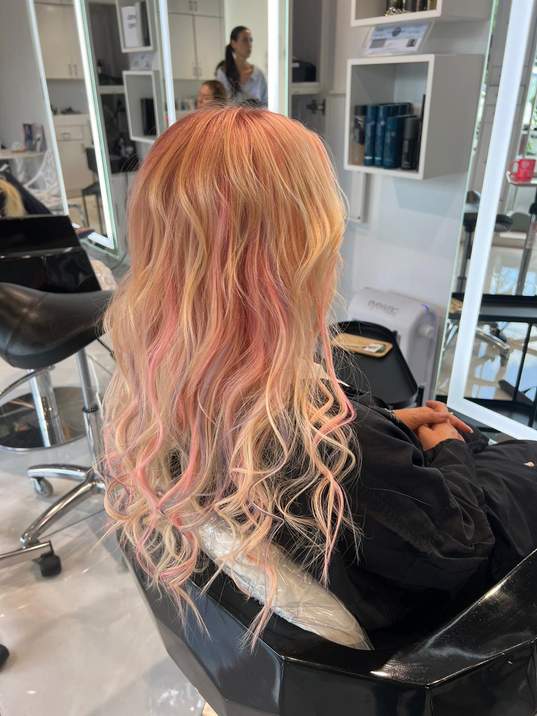 Long wavy hair with rose-gold and pink tones, alternate angle