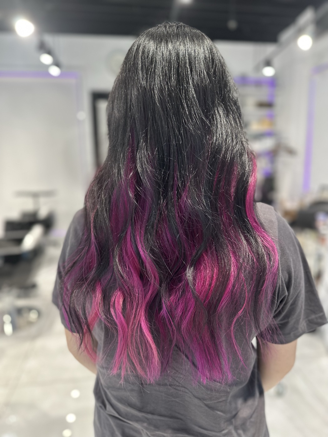 Long dark wavy hair with pink and purple ends