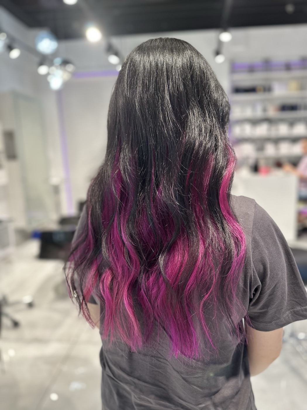 Long dark wavy hair with pink and purple ends, alternate angle