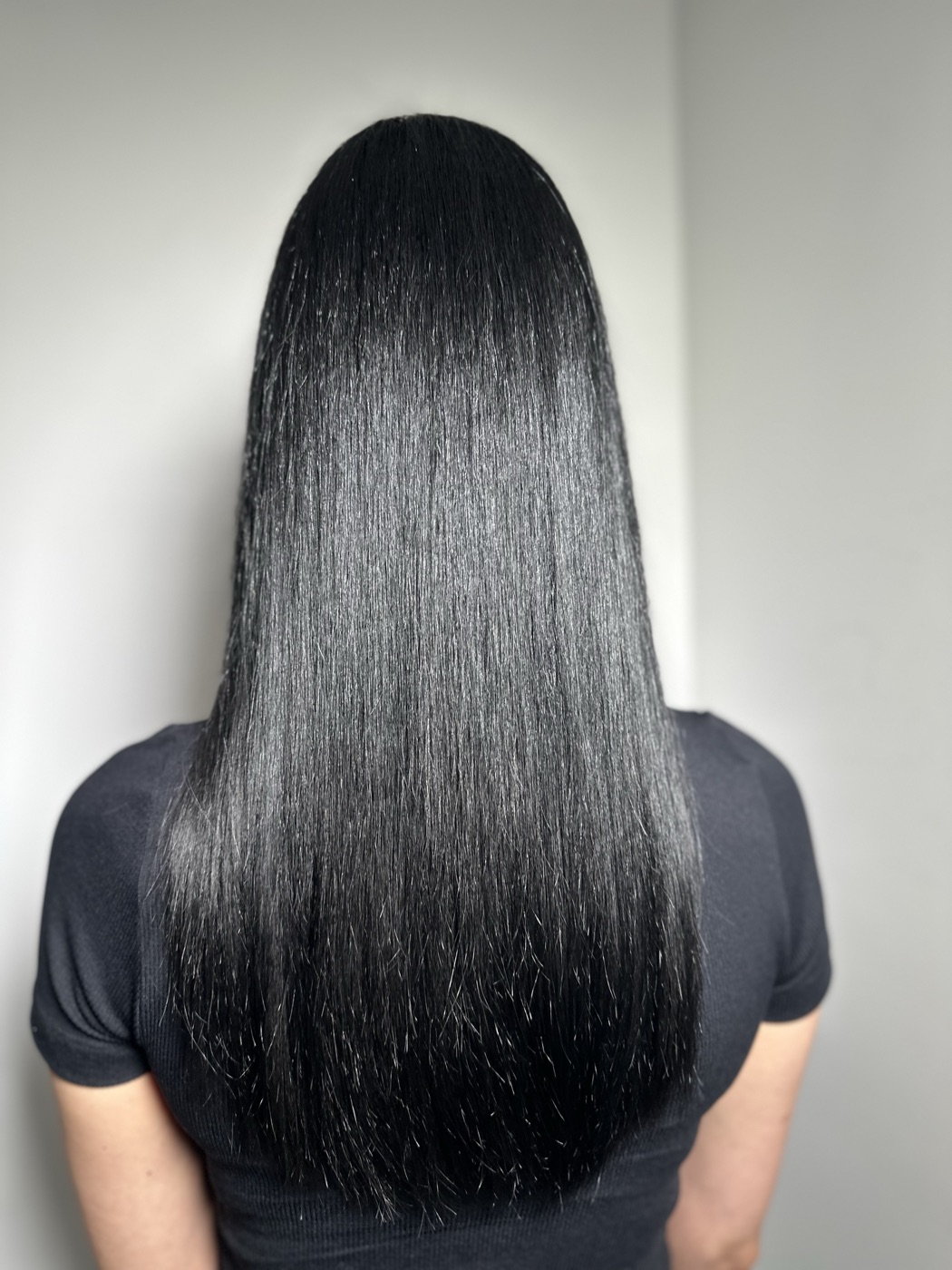 Long sleek black hair, back view