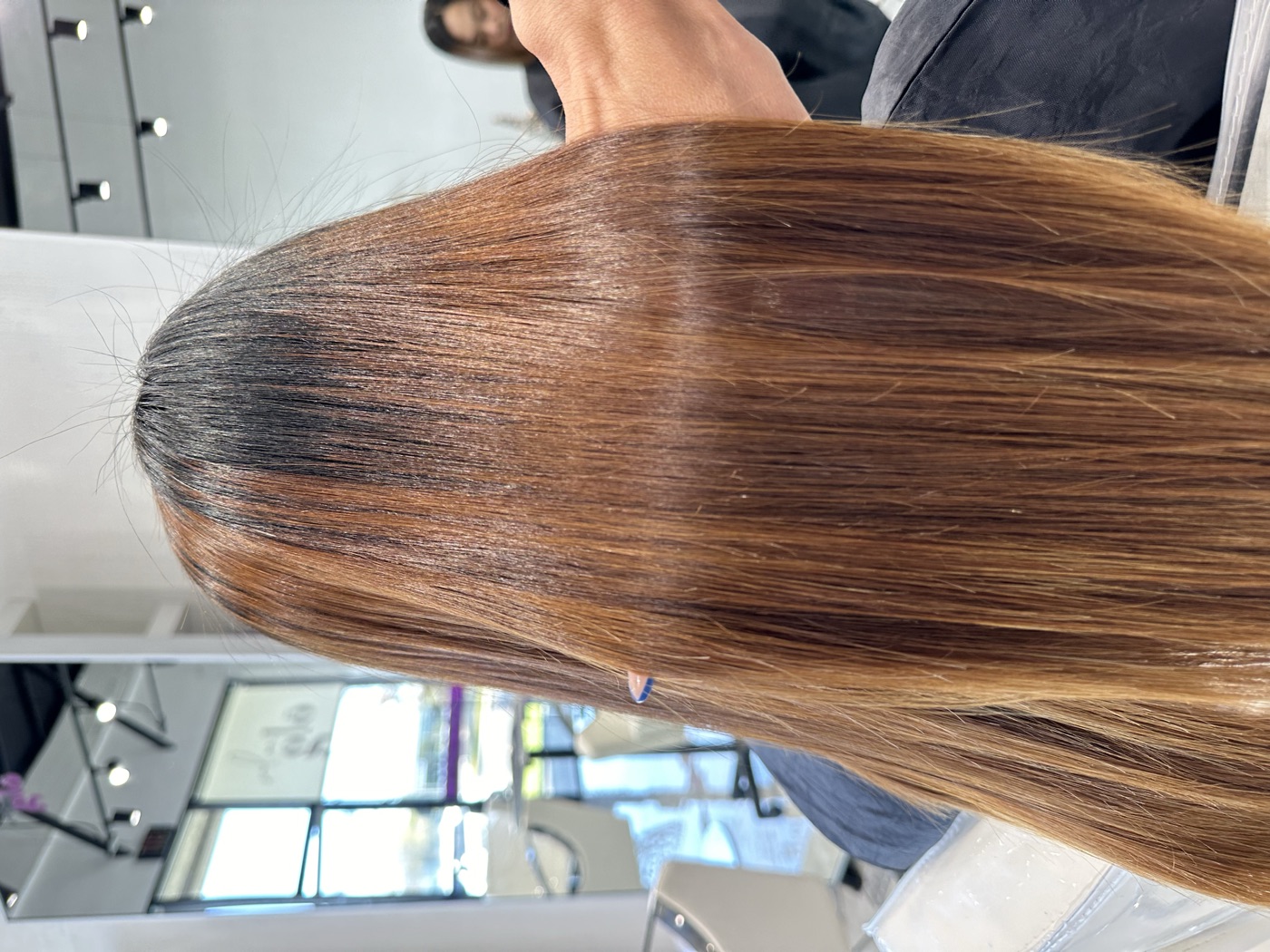 Long caramel-balayage sleek hair, alternate angle